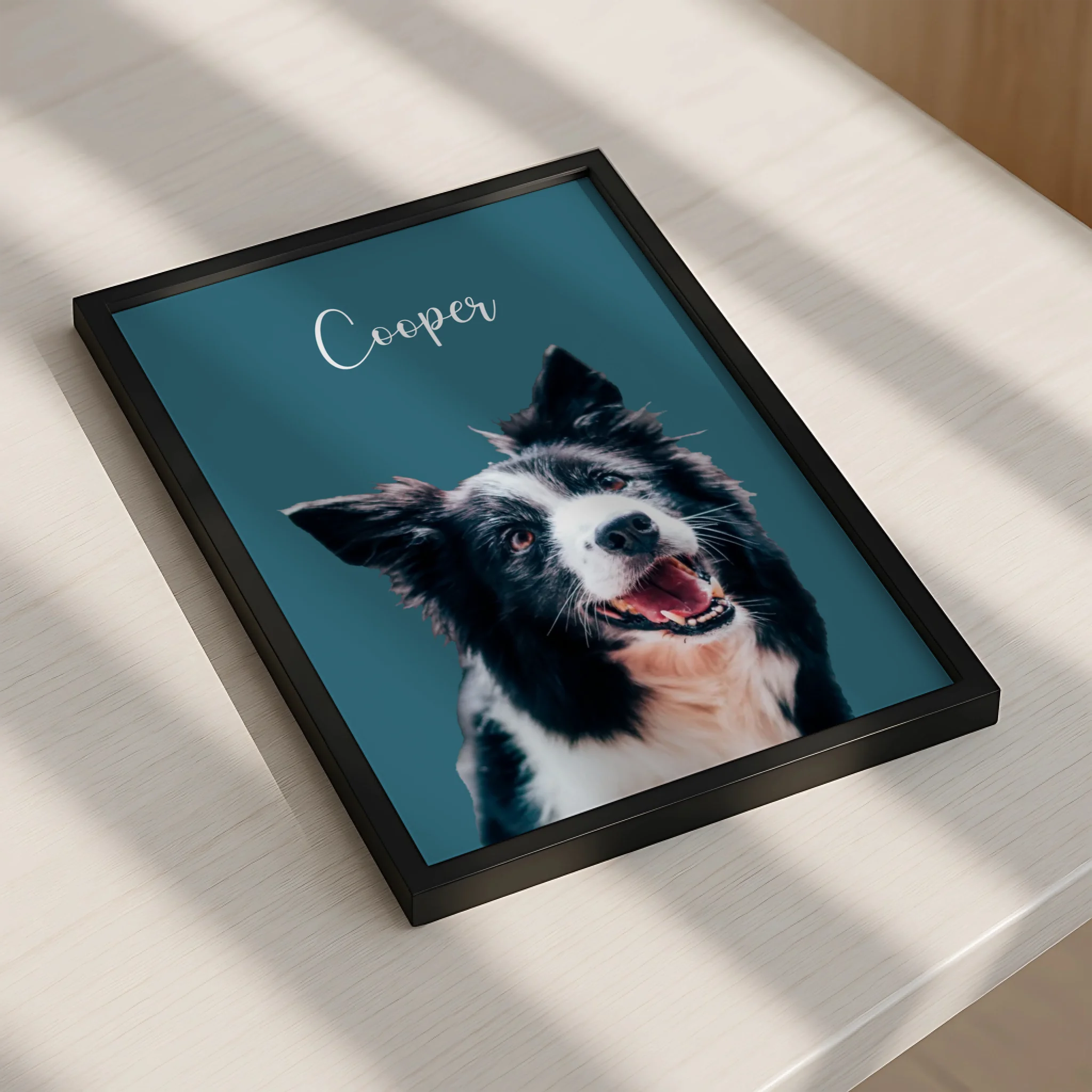 Personalised pet portrait print displayed in a photo frame on a shelf