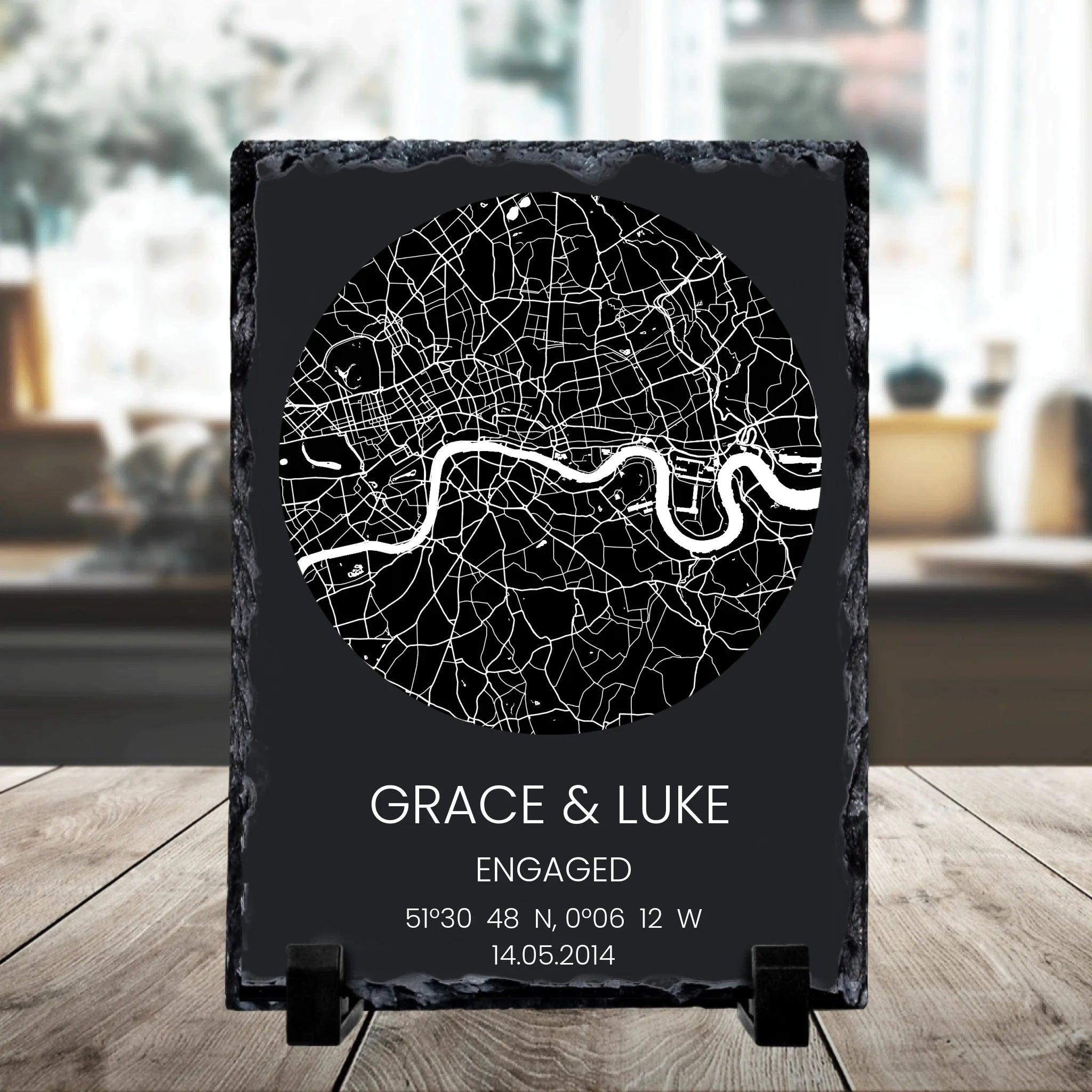 Close-up of a personalised photo slate showing a circular map with custom location text and coordinates