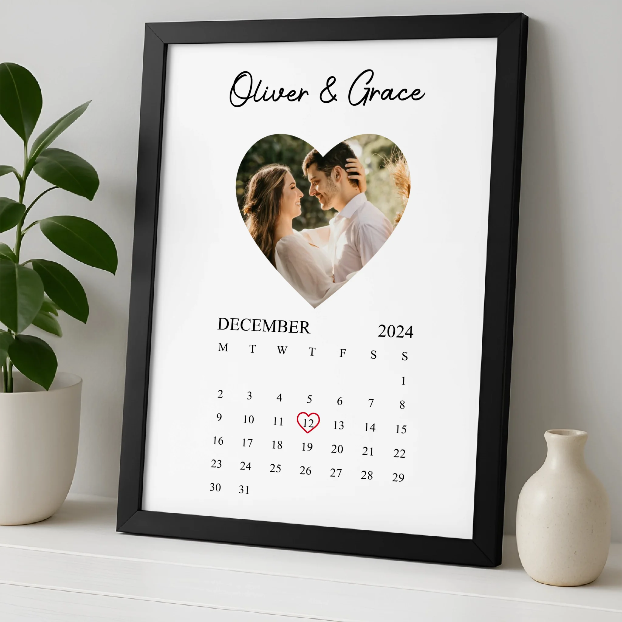 Custom photo calendar print displayed in an A4 frame on a wall