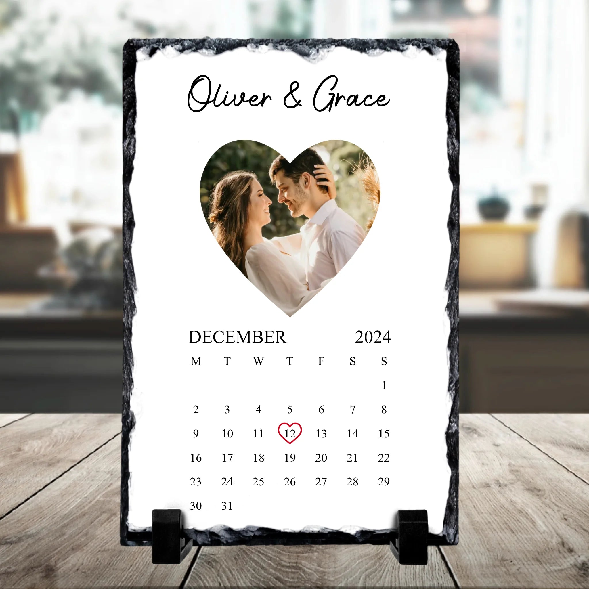 Rectangular personalised photo slate with heart motif, custom names and date, shown as a home keepsake