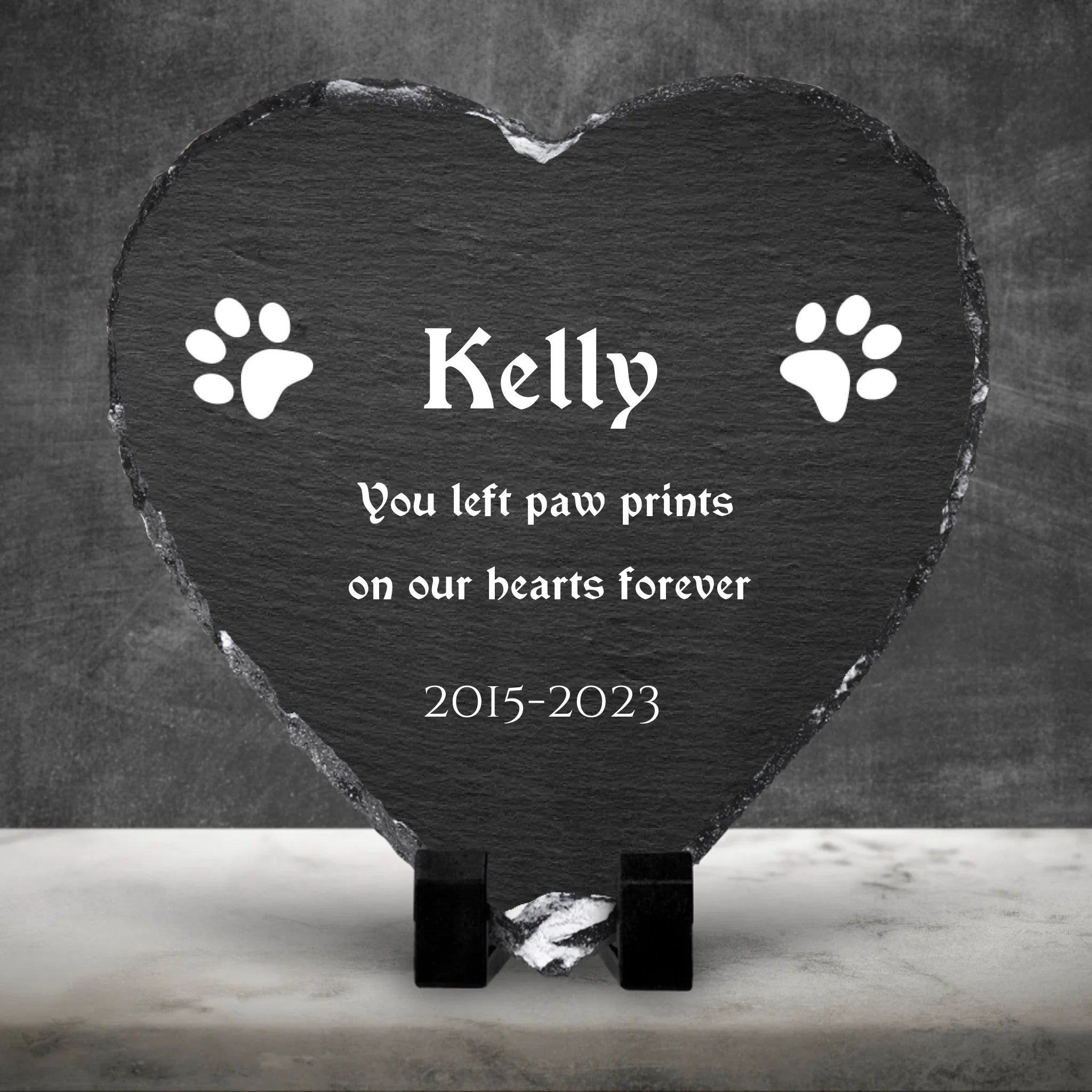 Custom personalised photo slate shown against a dark cement wall with marble floor background