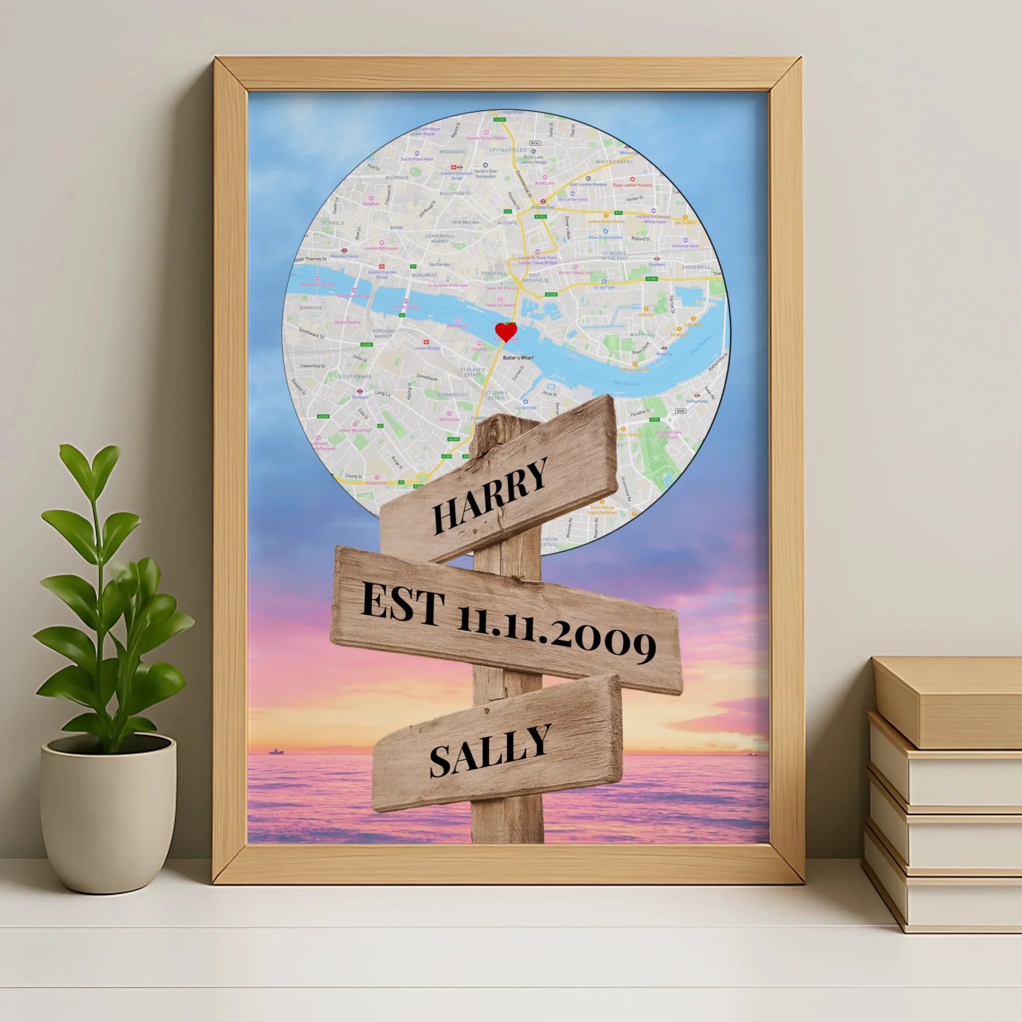 Personalised map print in an oak frame with custom names, date and location on a signpost