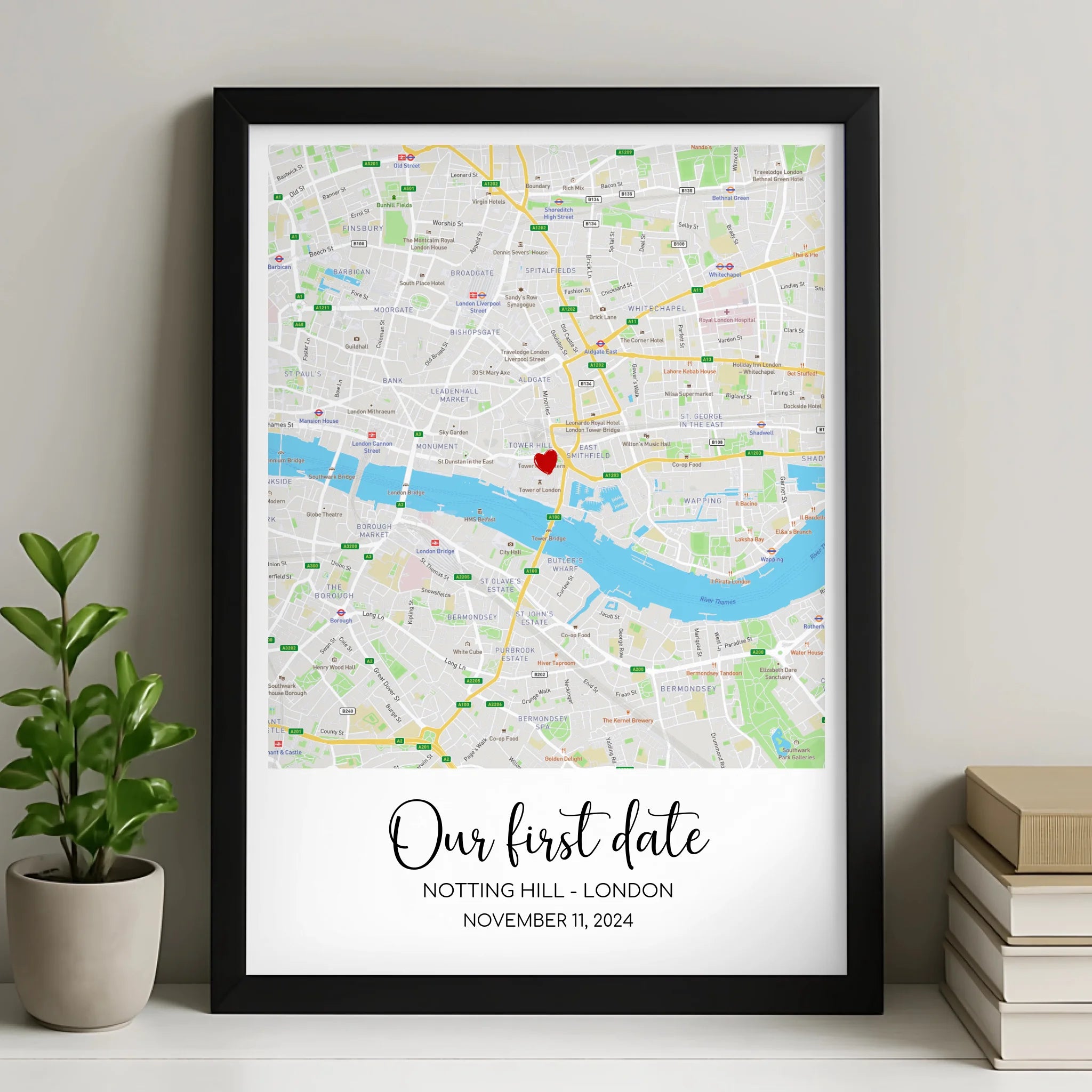 Personalised map print with heart marker showing couple's names and date, framed wall art