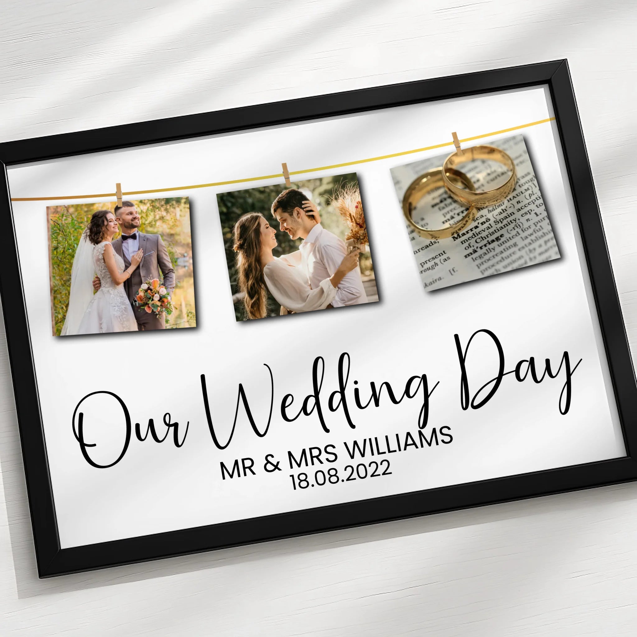 Black framed personalised wedding print with three pegged photos on a gold line and Our Wedding Day, Mr and Mrs Williams, 18.