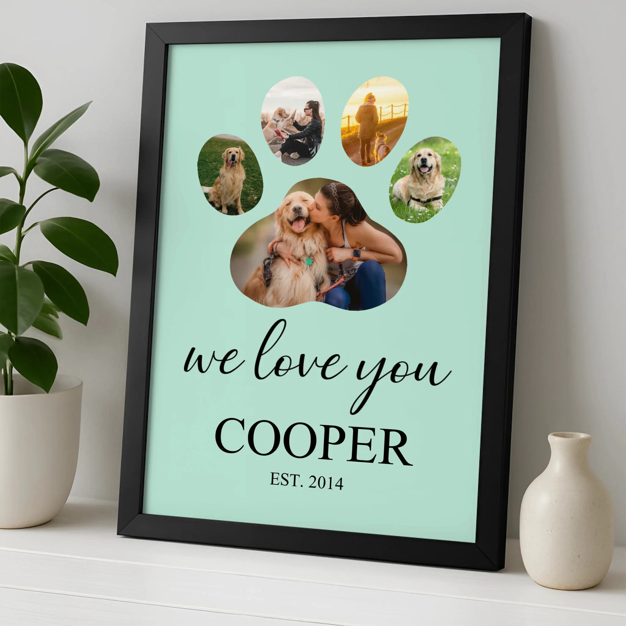 Close-up of personalised dog paw print photo frame showing name and year text