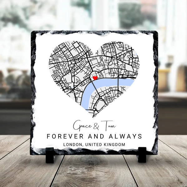 Personalised photo slate showing a heart map with two custom locations and couples names