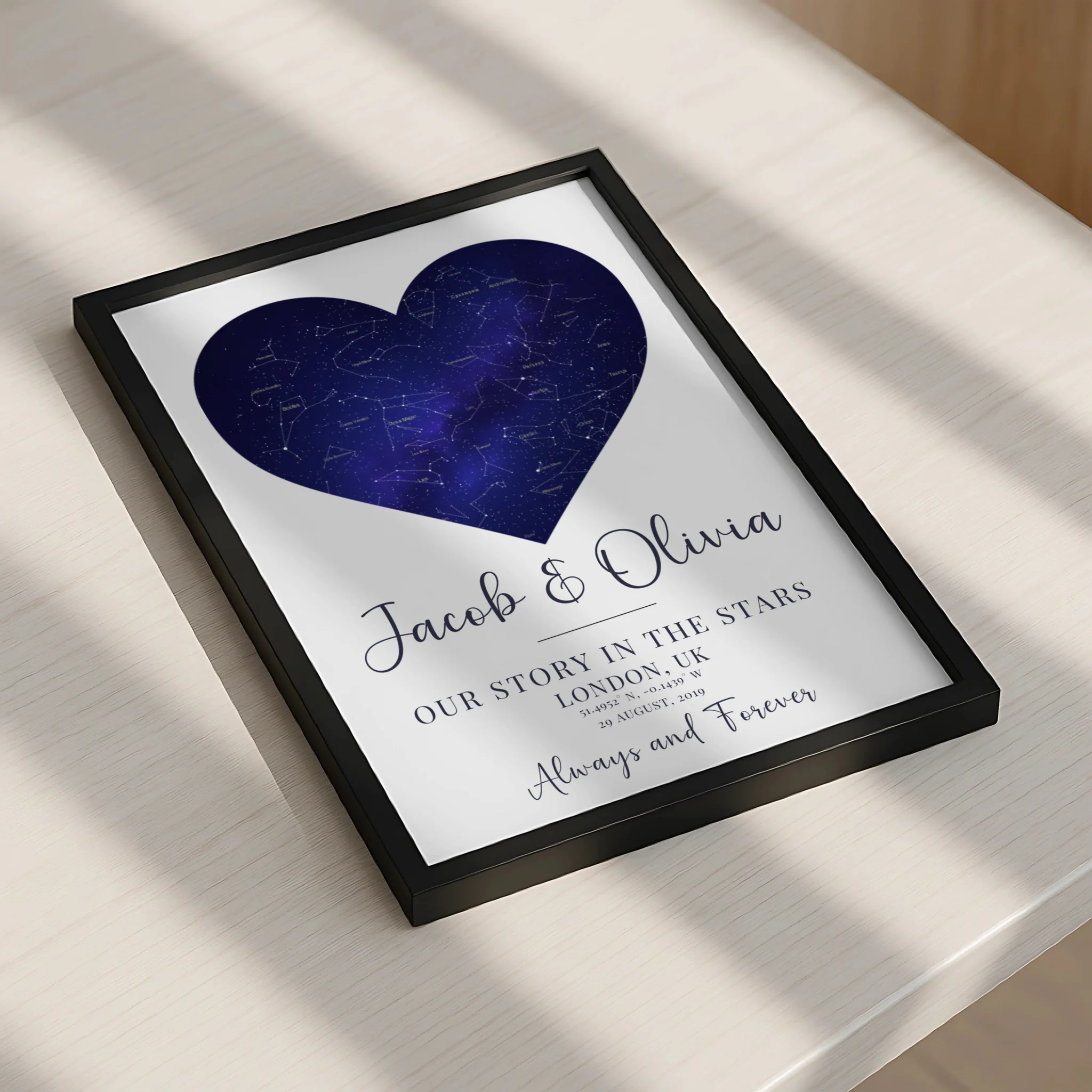 Framed personalised heart star map print displayed on a wall