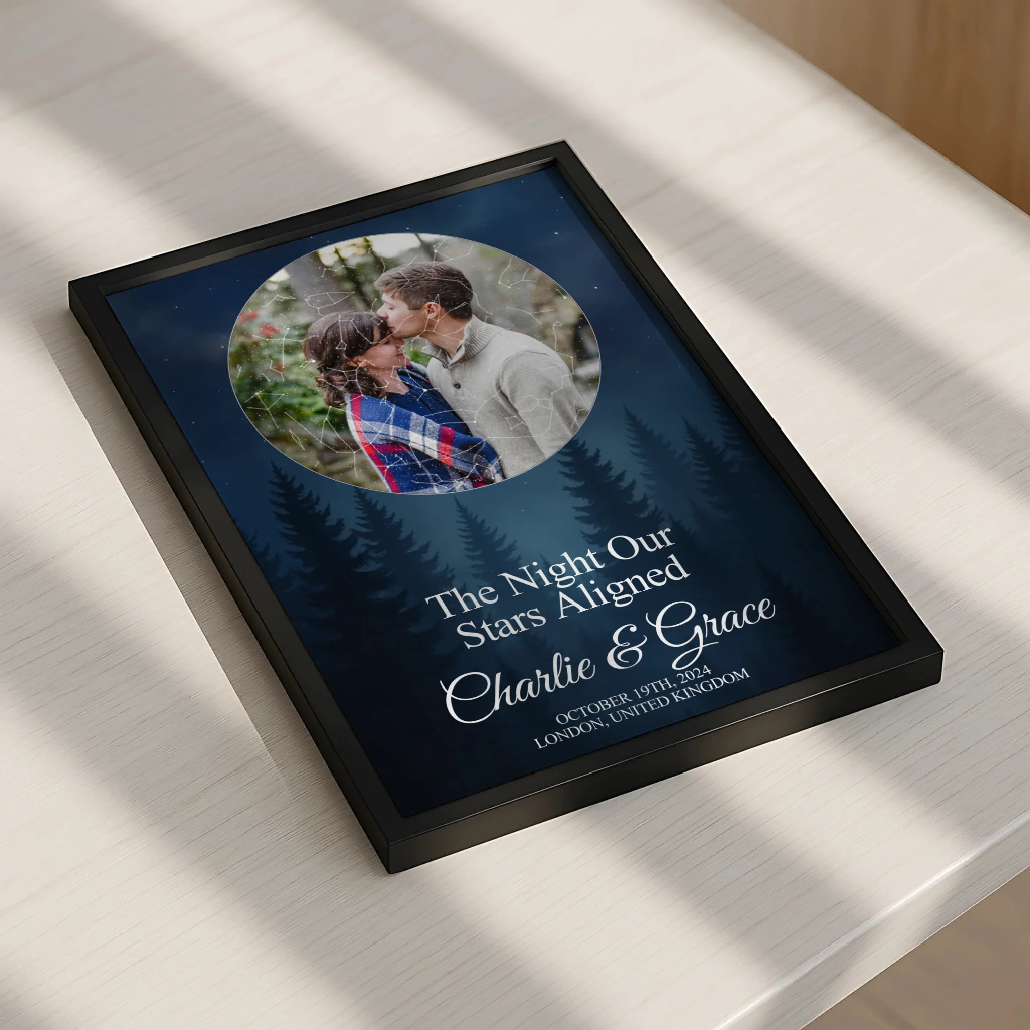 A3 personalised photo frame with star map design, names and date, displayed on a wall