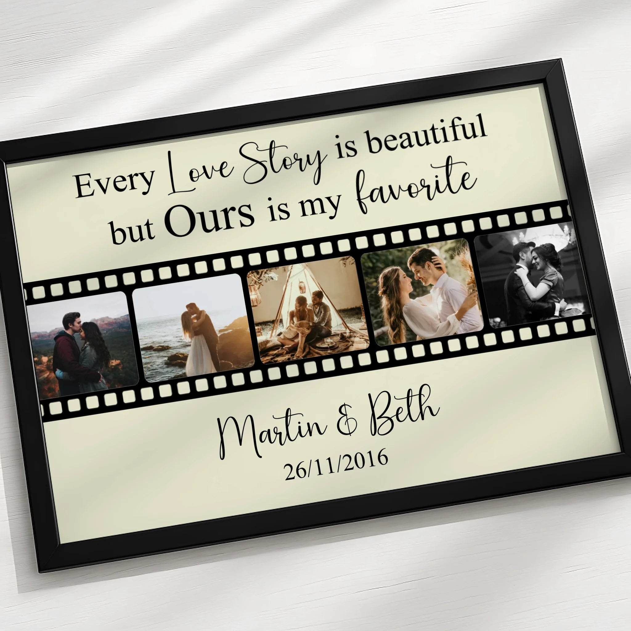 Film strip collage print displayed in a white frame on a wall