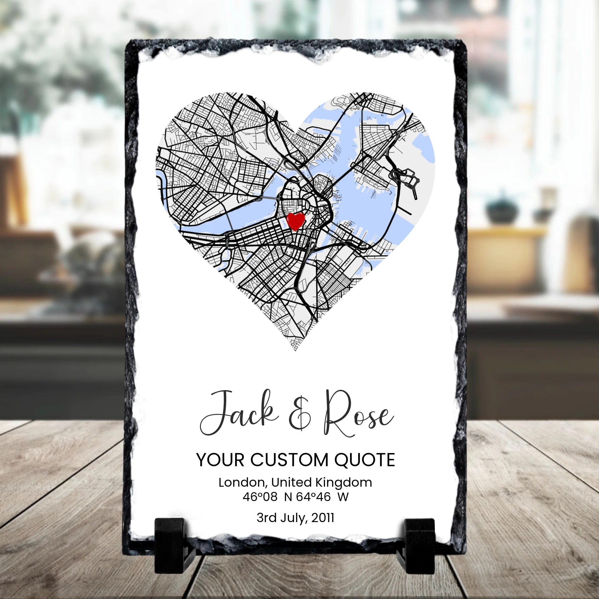 Rectangular personalised slate gift with heart map, coordinates and names, shown as a home keepsake display piece