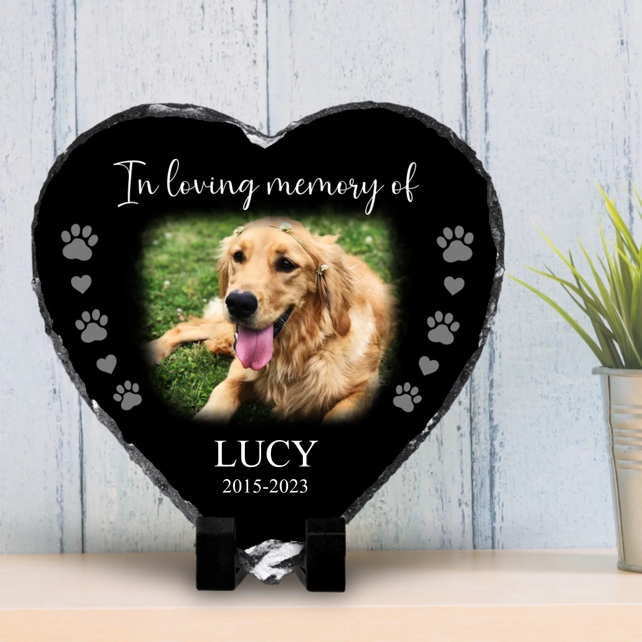 Custom pet memorial photo slate shown beside a vase of flowers as home decor