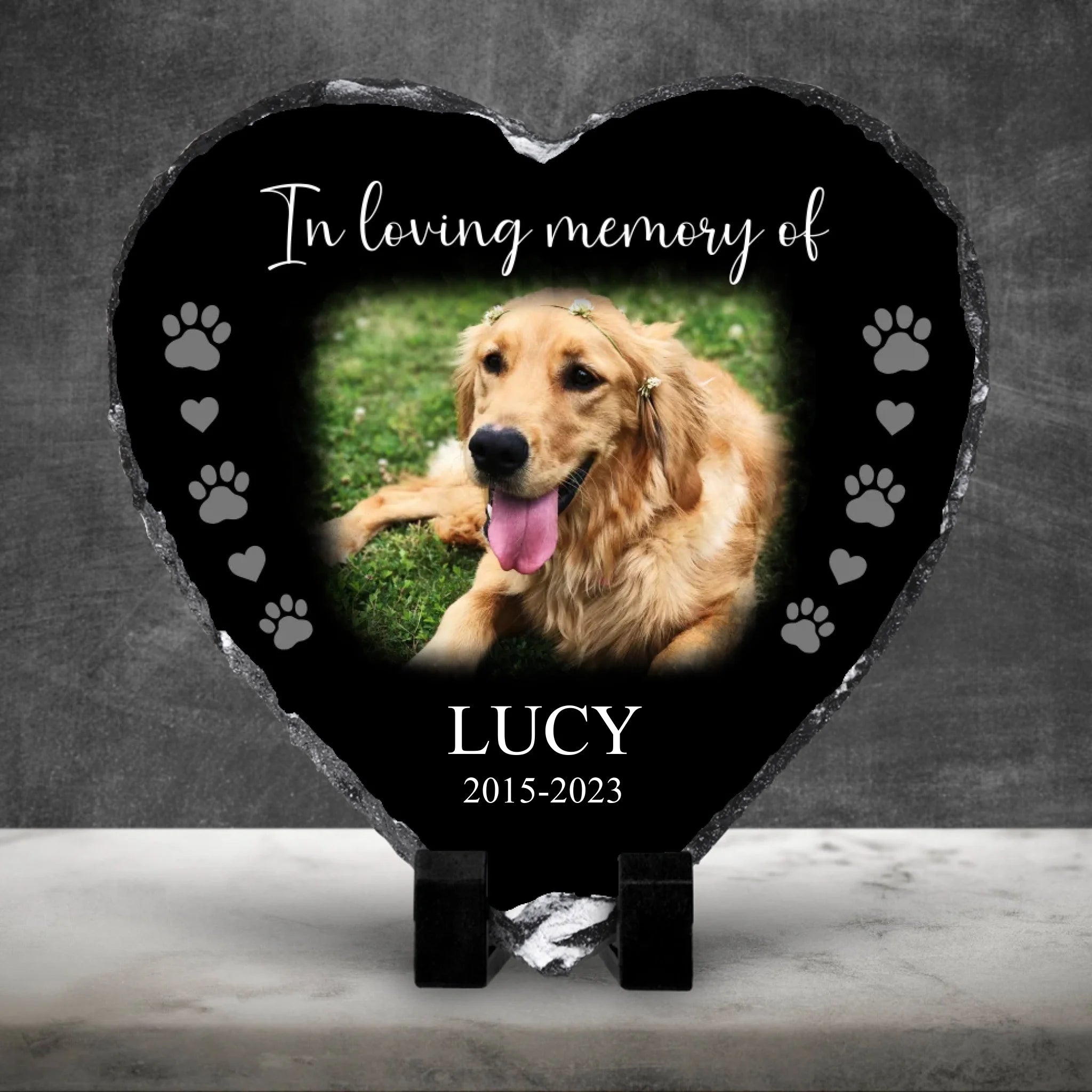 Custom photo slate memorial gift displayed against a dark wall with marble floor
