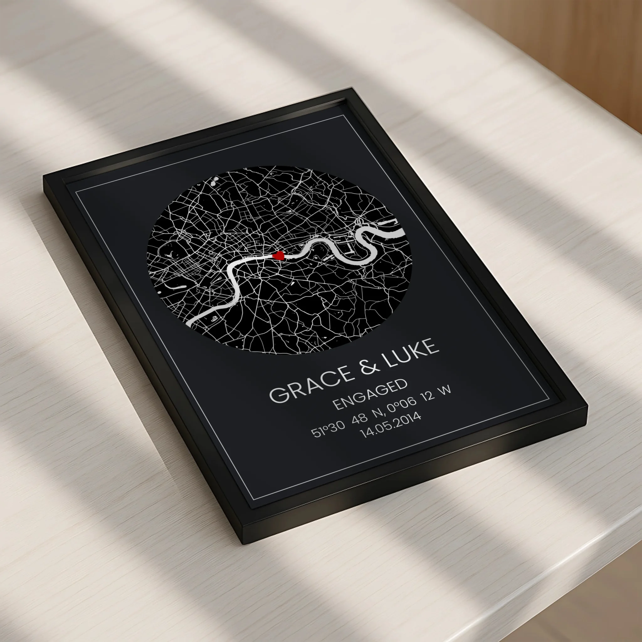 Personalised framed map print displayed on a shelf as a wedding or anniversary gift
