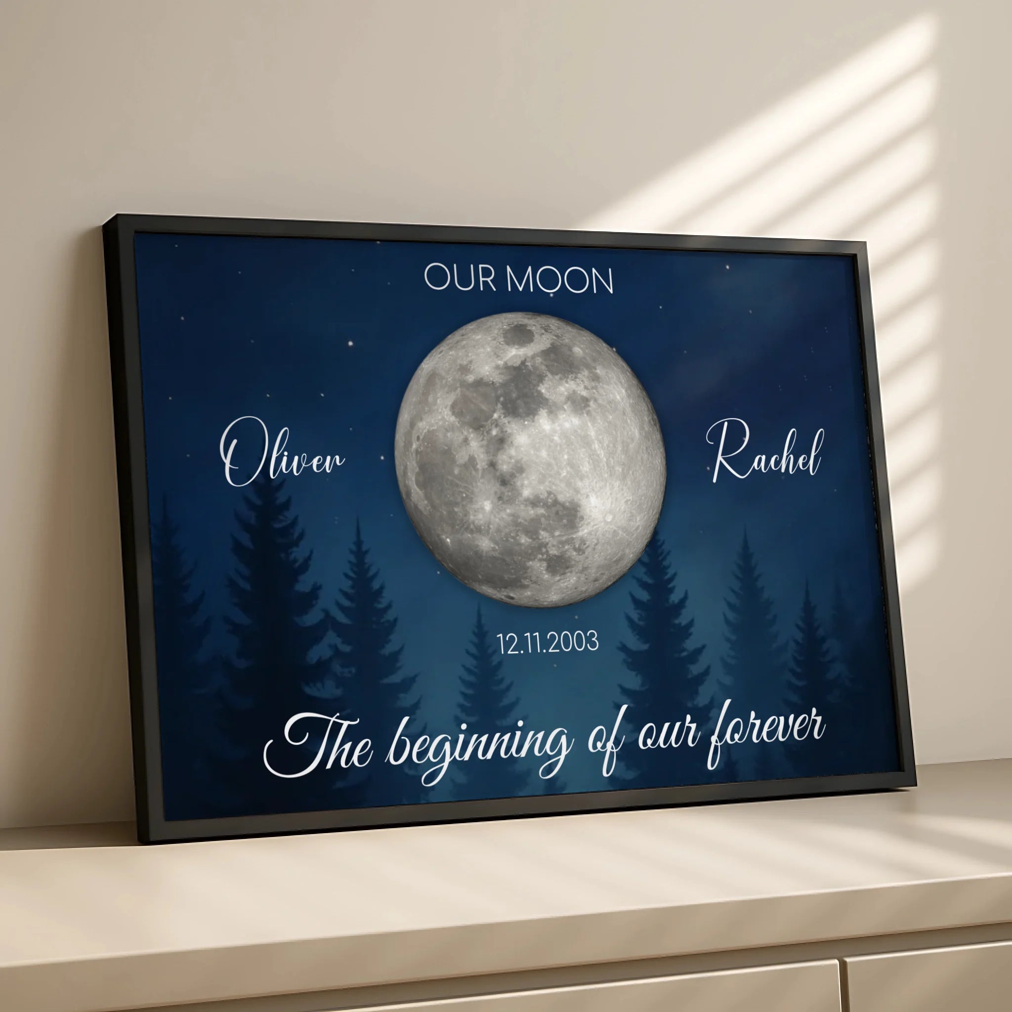 Personalised night sky print with moon phase, names and quote in a white frame on a wall