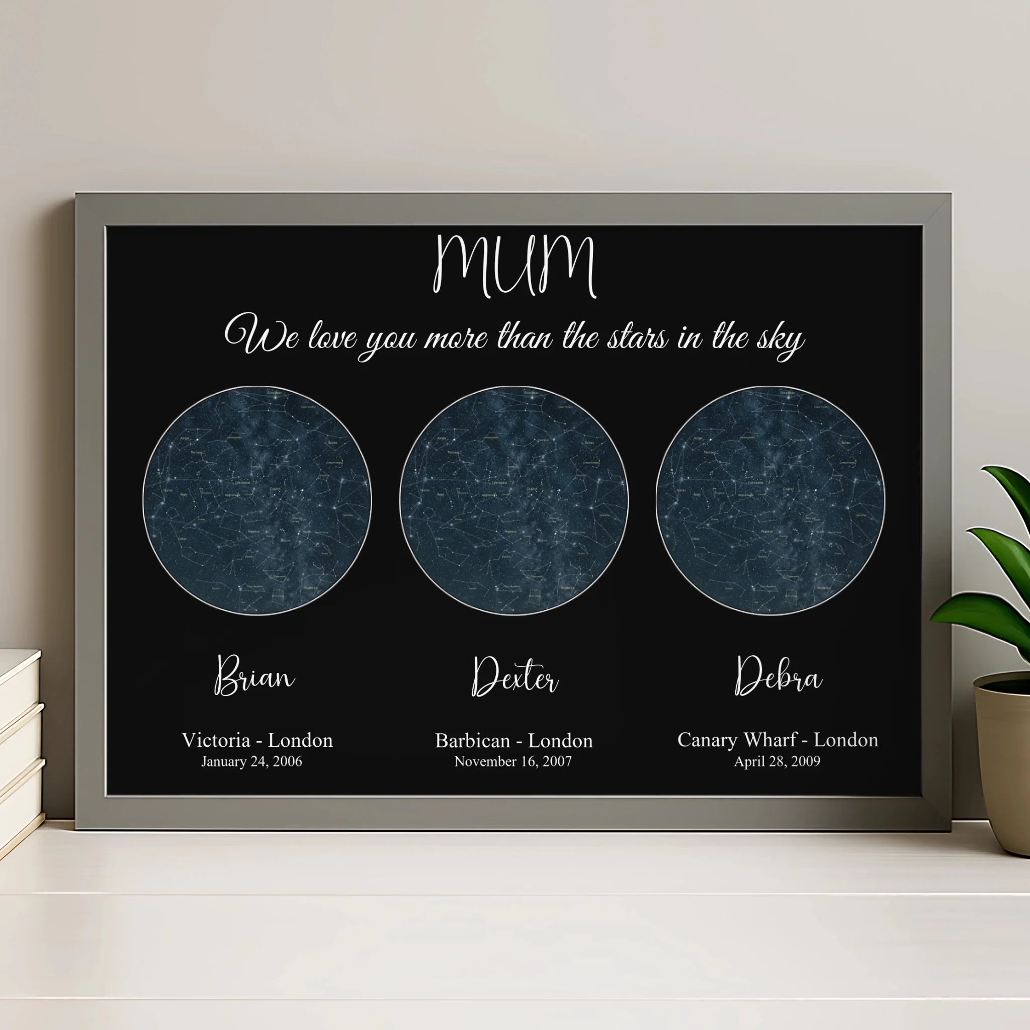 Personalised star map print in a grey frame showing custom night sky and date