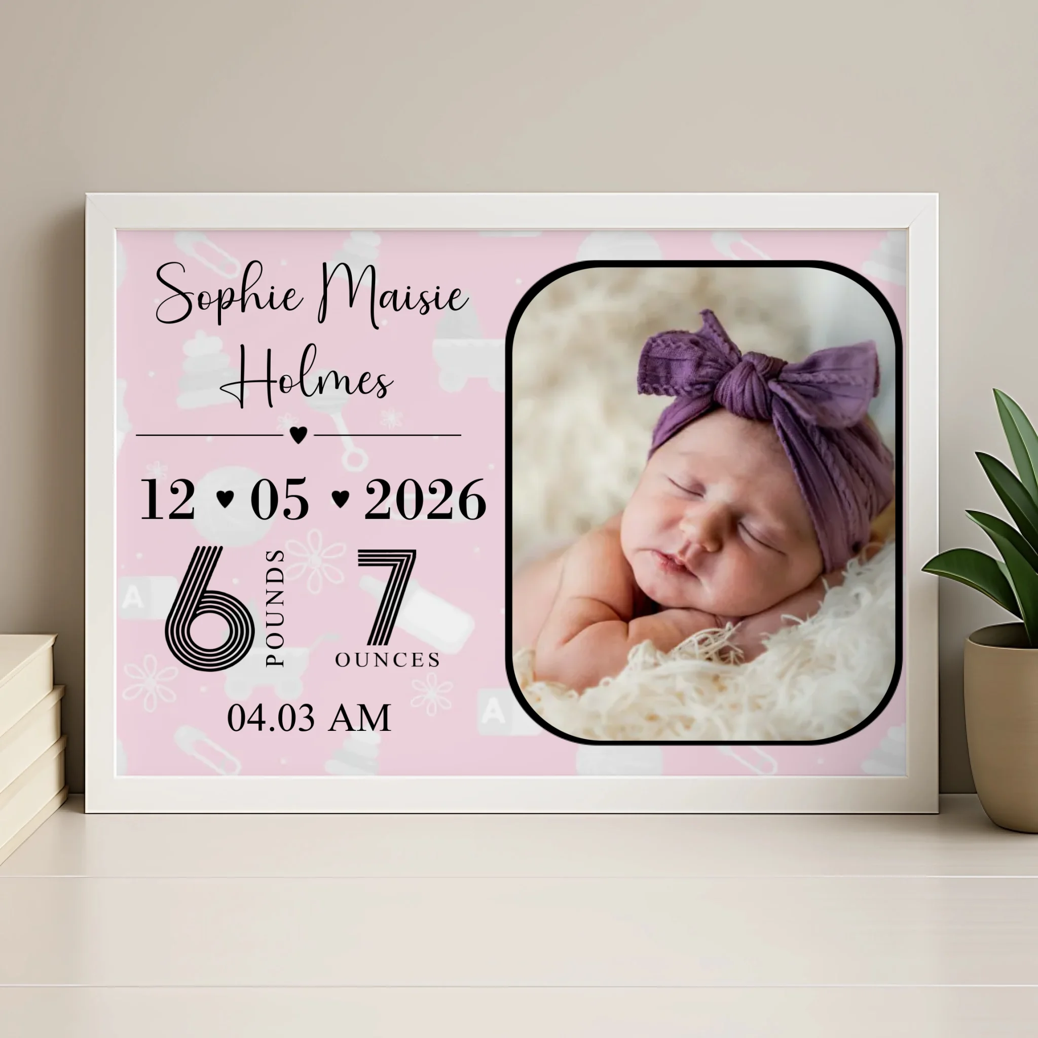 Custom newborn birth announcement print displayed in a wood photo frame