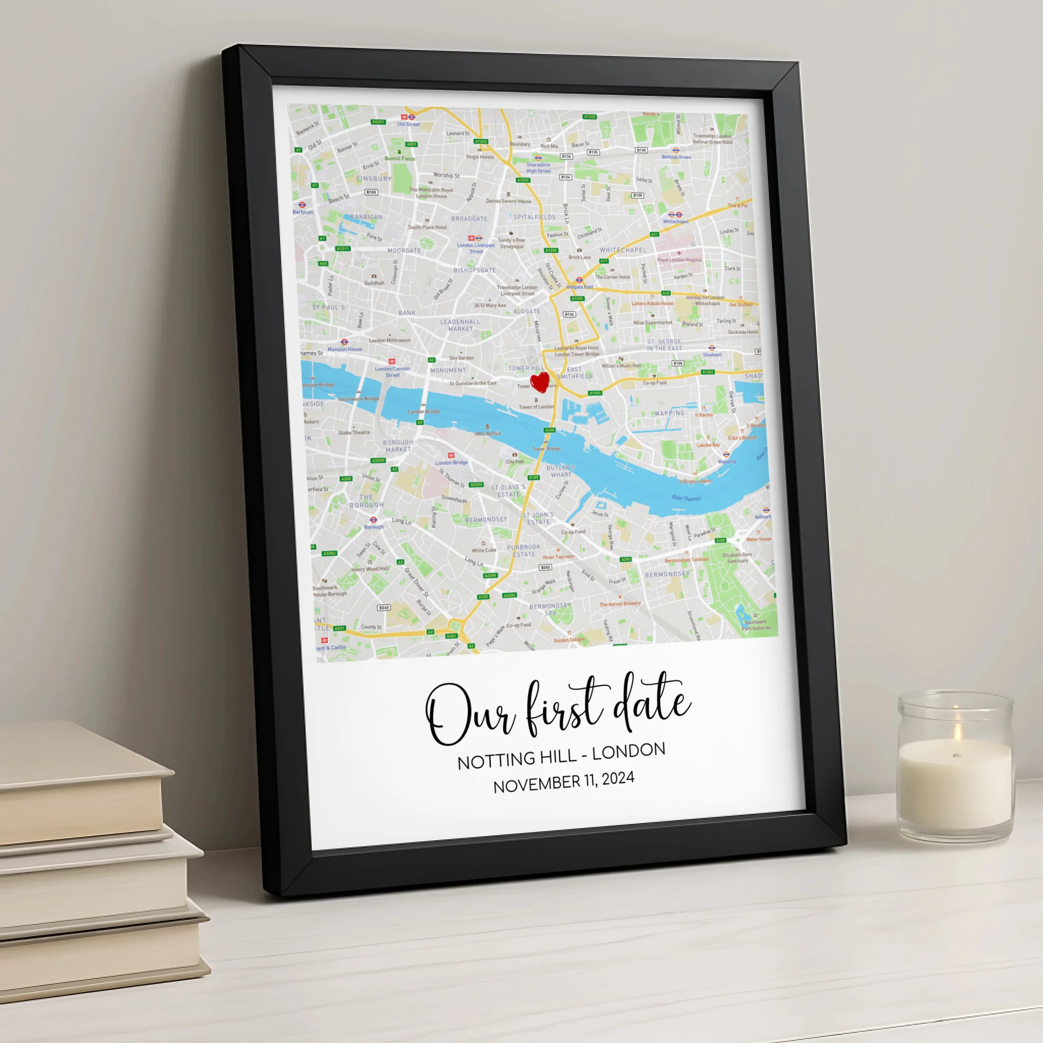 Personalised map print framed in white, showing location with heart marker and names