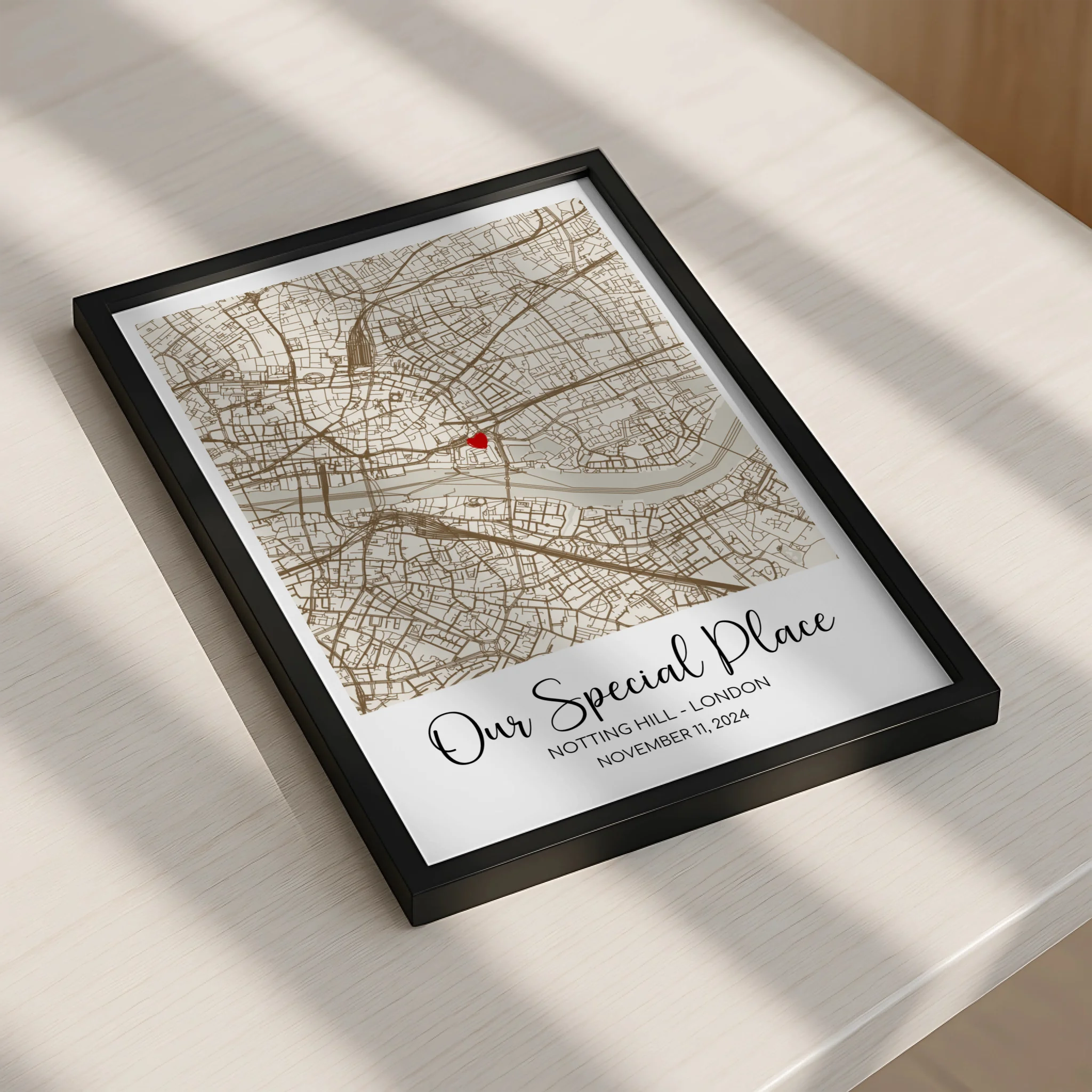Personalised location print in a photo frame showing a custom map with heart marker