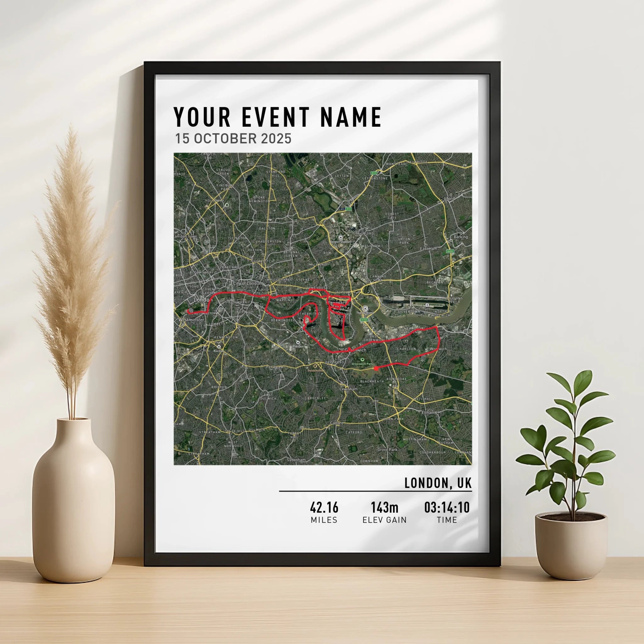 Close-up of a custom route map print showing cycling GPX data in a frame