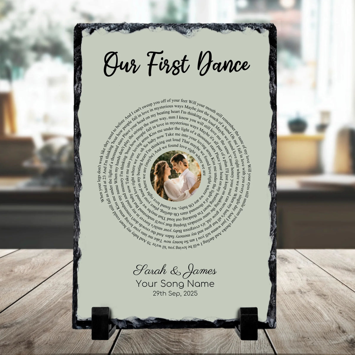 Portrait personalised slate plaque on a stand reading Our First Dance with spiral song lyrics, a couple's photo, Sarah and Ja