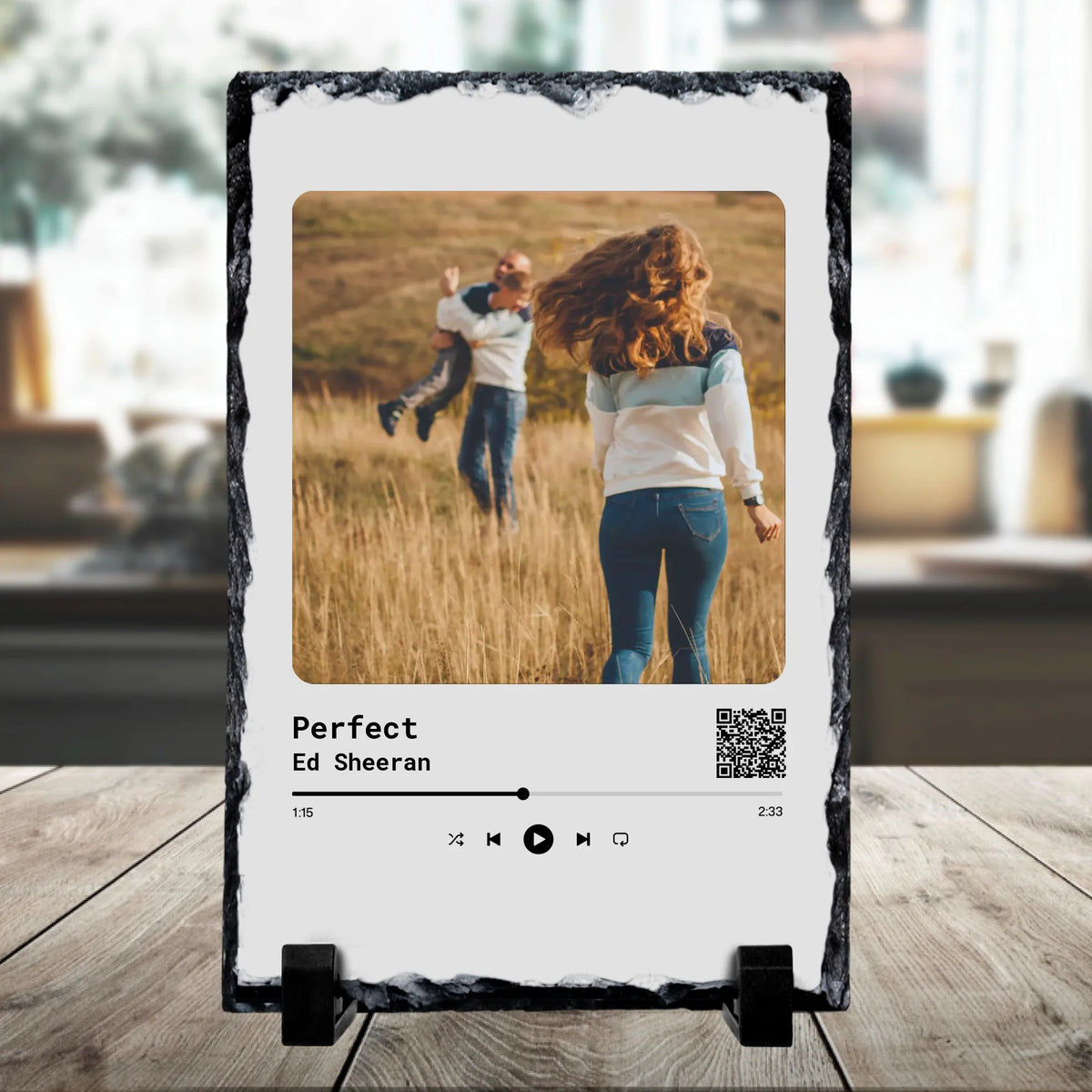 Close-up of a personalised music slate displaying a couple in a meadow, styled as a Spotify card for Perfect by Ed Sheeran wi