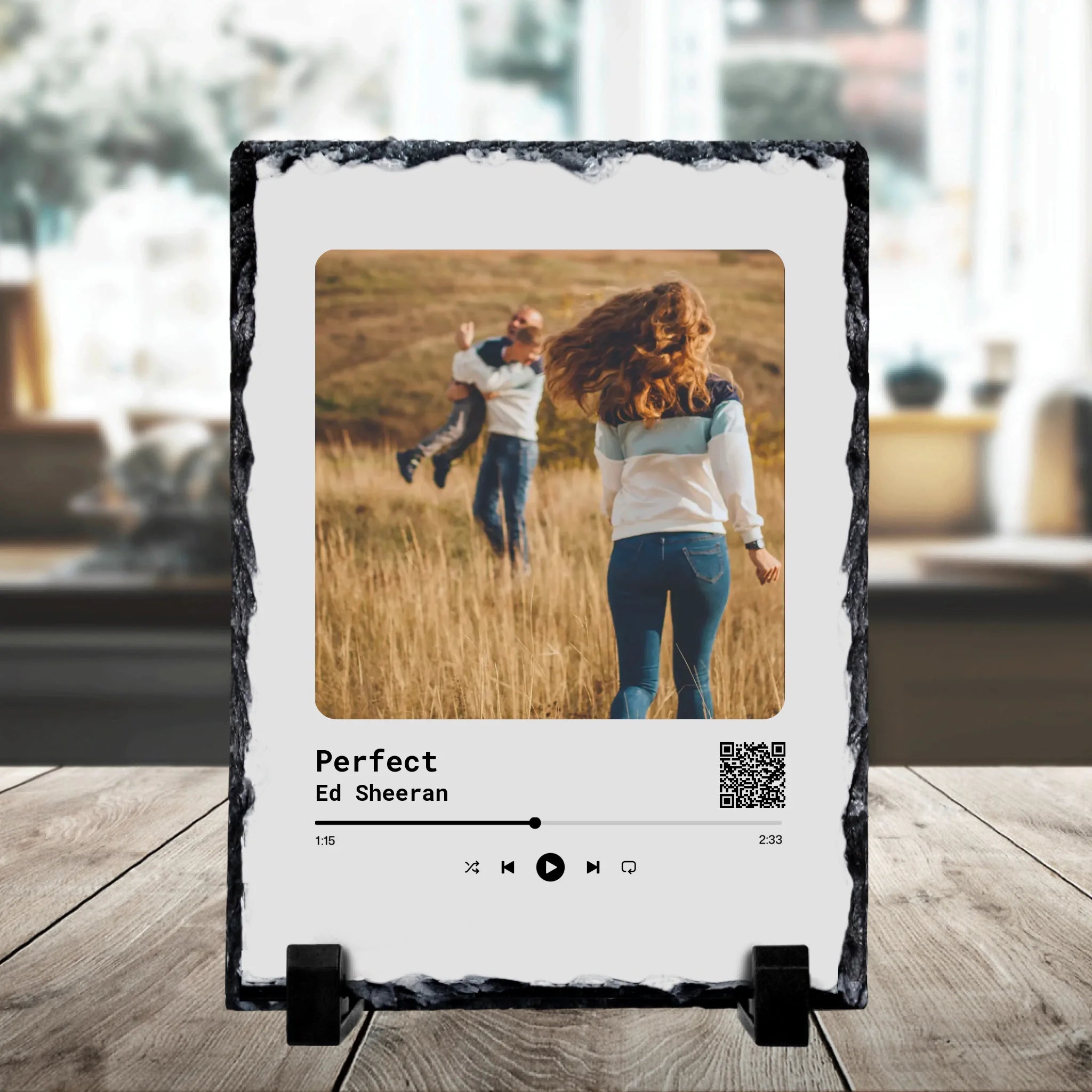Personalised photo slate on a stand showing a couple in a field, printed as a Spotify player for Perfect by Ed Sheeran with a
