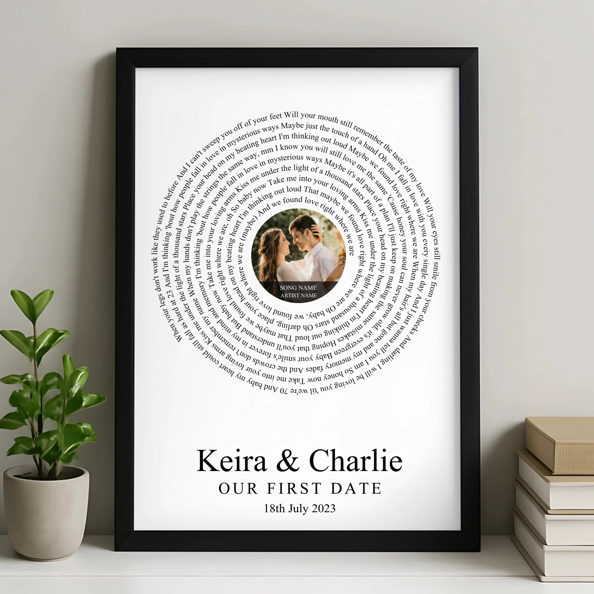 Black framed song lyrics print in a spiral pattern with a couple's photo in the centre, personalised for Keira and Charlie, O