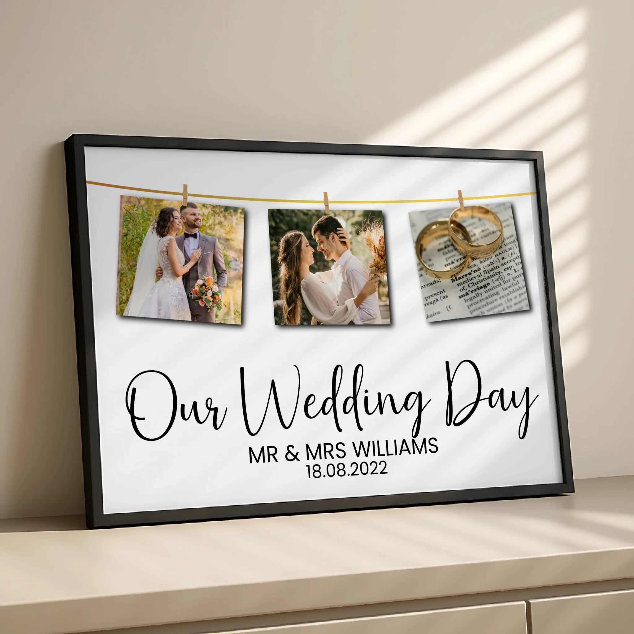 Black framed wedding day photo print with three pegged couple photos and personalised name and date text, displayed on a side