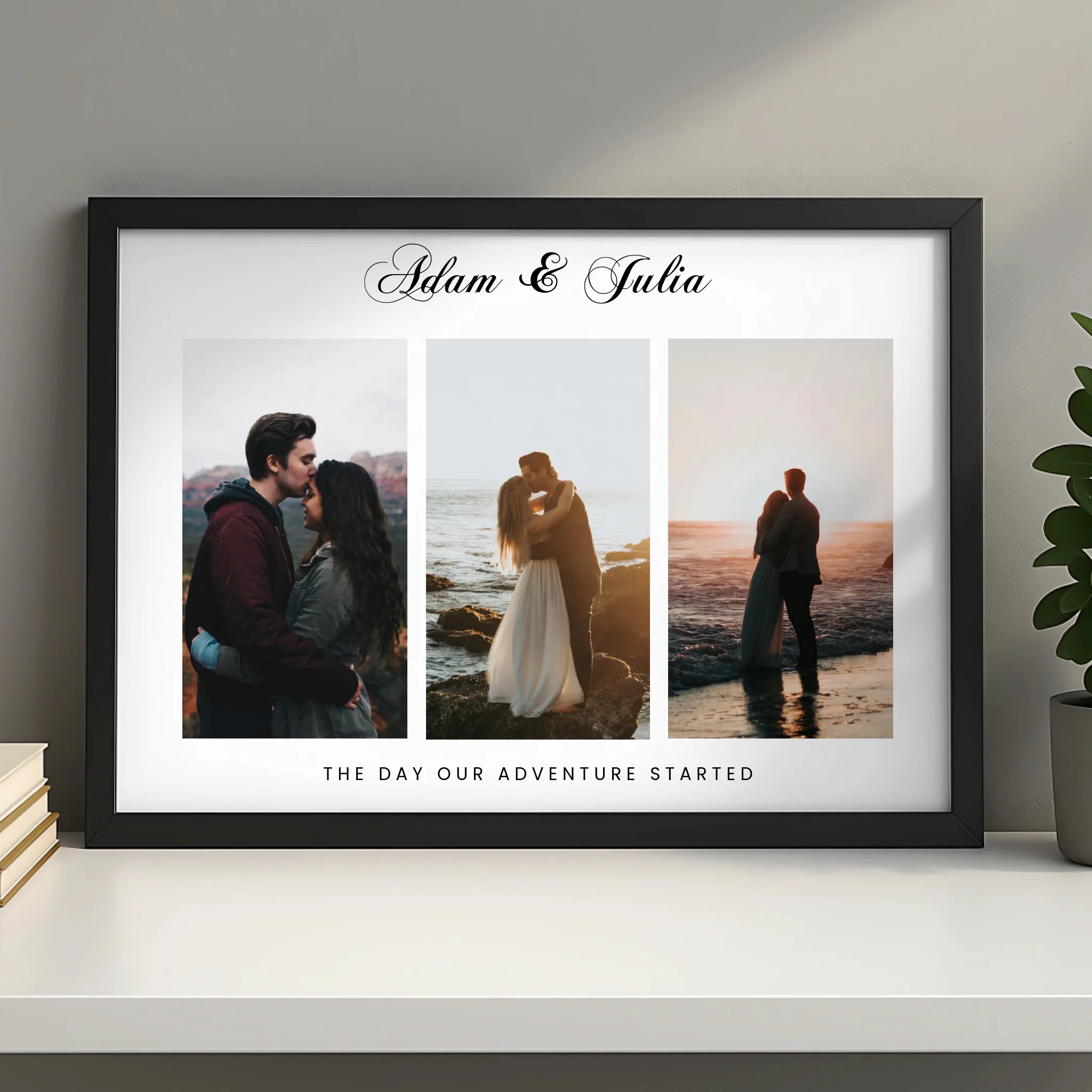 Black framed personalised couple photo print with Adam and Julia name and adventure quote, on a shelf beside stacked books an
